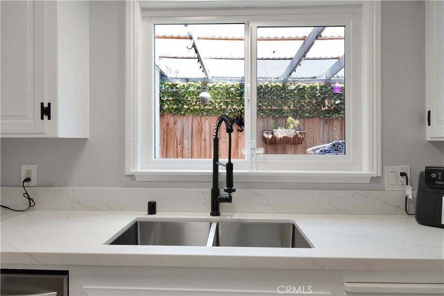 Located within the highly sought-after Troy High School boundaries, this beautifully renovated, gated home offers a true tropical retreat, surrounded by lush, mature landscaping that creates a private and peaceful setting.



Step inside this fully upgraded two-story unit—attached, with no neighbors above or below—and enjoy high-end finishes throughout, along with a charming urban garden that brings vibrant greenery right to your doorstep. The thoughtfully designed layout features ample storage both inside and in the garage, private laundry, and tasteful modern touches in every room.



The main bathroom feels like a spa escape, featuring a deep soaking tub enclosed in glass, a dual vanity, and stunning designer finishes.



Residents also enjoy resort-style community amenities, including a sparkling pool and a clean, well-maintained clubhouse—ideal for weekend relaxation or entertaining.



Perfectly situated with convenient freeway access, this home is just minutes from award-winning schools, world-class dining, premier shopping, and top-tier entertainment.



313 N. Acacia isn’t just a home—it’s a private oasis in the heart of it all. Come experience the lifestyle for yourself.