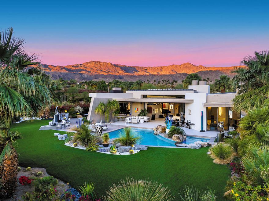 This beautifully remodeled contemporary home features 4 bedrooms and 4 1/2 baths.  The moment you arrive in the motor court you can sense the grandness of these home.  Entering the gated courtyard, you are greeted by a soothing water feature that runs along both side of the walkway.   Once in the home you are mesmerized by the breath taking mountain vistas, and lush surroundings.   The living area features upgraded lighting for art and pocket sliders leading the the entertainment patio, pool/spa and BBQ.  The state of the art kitchen features the latest decor appliances for the chef inside you. The primary bedroom offers a private sitting area that is perfect spot for reading a book.  The spa like primary bath features two water closets and two walk in closets, one of which is currently set up for Pilates.  An office with views of the courtyard water feature and mountain views is a great spot to get some work in.  The two interior guest suites  feature full baths and walk in closets to keep you guest comfortable.  The guest house off is located off the courtyard and feature a kitchenette, sitting area and fireplace.  The home has been remodeled in the past two years including the pool and spa.  The solar array is owned as well.