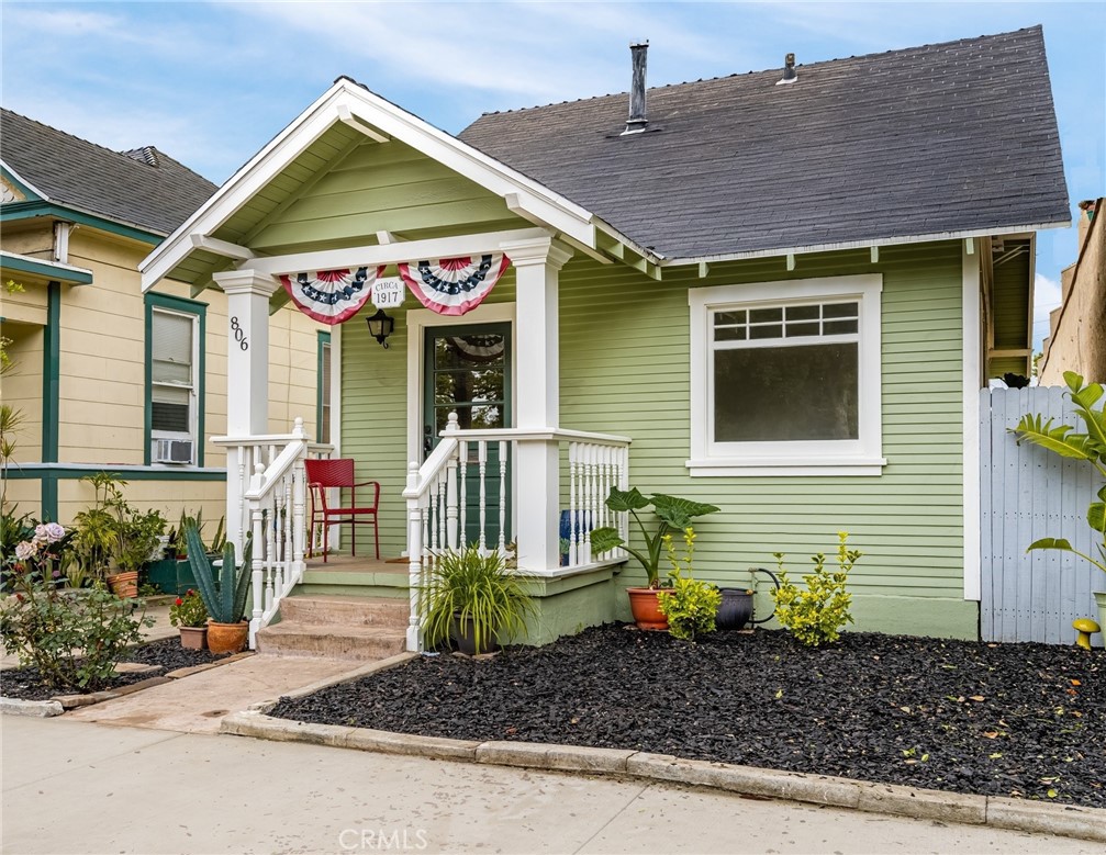 Charming and updated historic Santa Ana French Park home! Spacious backyard with a large patio, multiple planting areas, and its own private garage. Great first impression as you ascend the steps to the elevated front porch. Notice the covered sitting area and decorative craftsman columns that welcome you to 806 Minter Street. This desirable, detached home has a fresh, light and bright interior with new custom paint, and timeless ceramic tile flooring downstairs on a diagonal pattern. The original 1917 hardwood flooring upstairs has been beautifully refinished, and the bathroom has been remodeled. Step out back and enjoy Southern California weather year-round. The yard is fully fenced and offers attractive pavers, raised planters, a garden, and a portable firepit. There is plenty of space to BBQ and entertain outdoors. Zero maintenance concrete side yard. Back inside, the front room has a picture window facing the front yard. There is a dedicated eating area with built-in cabinetry, including drawers and upper glass door display shelves. The efficient kitchen boasts ample counter space, custom tile decorative backsplash, and a dual basin stainless steel sink that includes a pullout faucet and window above. Note the stainless steel GE® 4-burner gas range and built-in microwave above. Off the kitchen is the highly coveted indoor laundry room with a full-size Maytag® Centennial washer and dryer included. There is a main floor bedroom with a walk-in closet. The fully updated bathroom has a new pedestal sink, shower over the tub with a glass door enclosure and wall to ceiling custom tile. Huge secondary bedroom is upstairs with (2) full size closets and vaulted ceilings. Wait, there’s more: thermostat-controlled gas wall heater, (3) window A/C units, ceiling fans, and energy saving LED Daylight-5000 lighting throughout. Private (1) car garage with a side door to the backyard. WalkScore® of 96; walk to everything! Ideally located close to all freeways, and walking distance to multiple schools, the French Park, government buildings, 4th Street Market, Artist Village, Transportation Center, shopping, and plenty of great dining options. Submit for any pets. 10/01/2025 move-in.