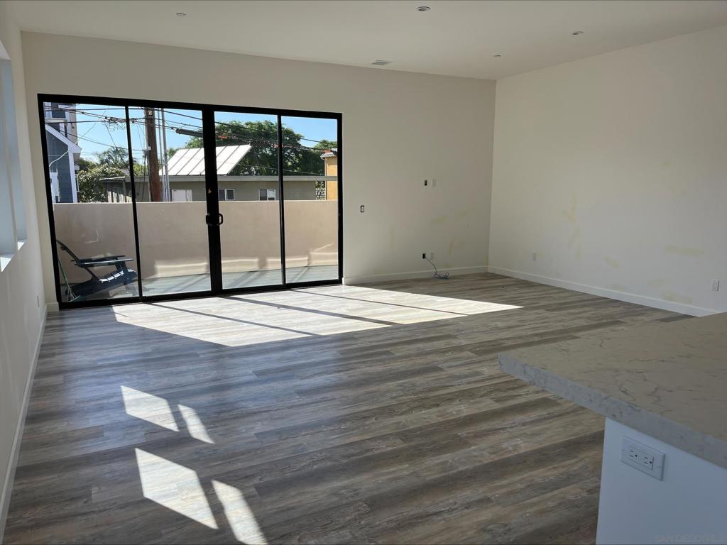 Built in 2023 and just one block from the Coronado Ferry Landing, this stunning 4-bedroom, 3.5-bath townhouse blends modern design with exceptional convenience. The main level features one bedroom and a full bath, a dedicated office, and a laundry room with premium washer and dryer included. Upstairs, you’ll find three more bedrooms, including a spacious primary suite with dual closets, along with two and a half additional baths. The custom kitchen is a chef’s dream with an oversized island, designer cabinetry, and top-brand appliances. High 10-foot ceilings enhance the open feel of the expansive dining and living areas, while large windows and oversized sliding glass doors flood the home with natural light. Step out onto the private balconies or take the spiral staircase to the rooftop deck, where you’ll enjoy sweeping views of Coronado. Additional highlights include central air and heat, solar power to help reduce electric bills, one-car garage plus an assigned parking space, and an EV charging station. Located just moments from restaurants, shops, parks, the beach, and bay, with the school and library only five blocks away. Yearly lease, renewable.