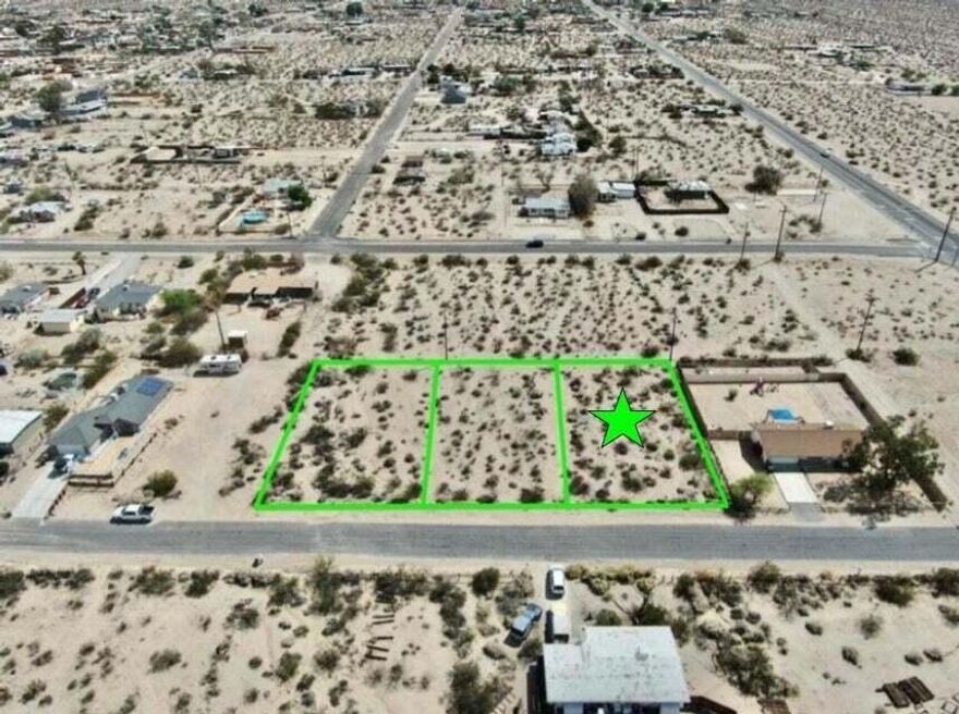 Owner may carry! Turn Key lot with utilities and paved road. 11,100 square foot (quarter acre) lot the trendy Hanson Area neighborhood in 29 Palms! Ideal for a developer or long term investor. The Hanson Area is known for its views. Set on a gentle incline offering northern vistas of the Bullion Mtns. To the west are the boulder studded Little San Bernardino Mtns with Joshua Peak. To the east are the Twentynine Palms Mtns. Quiet neighborhood. Close to the 29 Palms Restaurant and Inn, Theatre 29, and the Tortoise Rock Casino. Just down the road is the 29 Palms gate to the Joshua Tree National Monument. About 3 million tourists visit the park annually. Great vacation area. A few miles to the north is downtown 29 Palms with the new Freedom Mall and all amenities. Celebrities, artists and musicians are now calling 29 Palms home more than ever before. Would be great for a designer modern home or go with a prefab manufactured. Two adjacent lots are also for sale. Buyers must contact the city for all questions on building and usage. Buyers must contact the utilities agencies for all questions on utilities. APN: 0624-012-17-0000 Address is not a real address and for marketing purposes only. GPS: 34.12218, -116.0355 Don't Wait! Call Now!