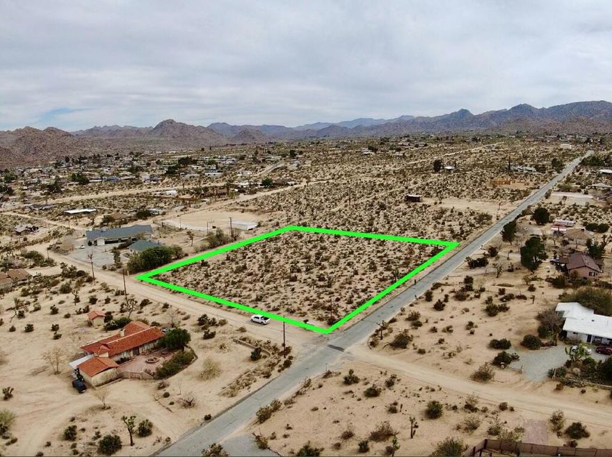 Beautiful & rare double lot that was Previously Approved for building. Featuring 2.5 acres in the highly desirable Friendly Hills neighborhood in South Joshua Tree. Utilities appear to be in the street. Views for miles. This lot is ready for your custom home! The property was 2 lots & has been merged. The new owner can split the lots if needed. Reports / survey / percolation tests have been completed & approved. A gentle slope offers inspiring vistas of Mt Bartlett, Copper Mtn, & the boulder studded hills of the Little San Bernardino Mtns. Close to the Joshua Tree Village for organic restaurants, boutiques, cafes, & the JT Saloon. Private setting. Starry nights. 5 minutes to the main entrance of JT National Monument where about 3 million tourists visited the park annually. Superior vacation rental area. Beautiful natural desert fauna with cholla cactus, creosote bushes, yuccas, & mature Joshua Trees. Optional driveway access from the back of property if you desire to maintain the pristine native flora. Building plans available for an additional price. Million dollar homes in the neighborhood. Truly a dream property. Buyers must contact the county & utility agencies with all questions on building and uses. Don't wait - Call now! APN: 0602-081-16-0000
