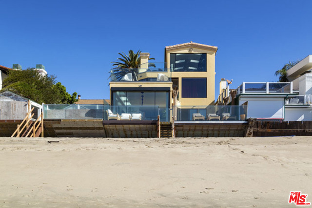 Prime Malibu Colony Oceanfront Beach House. Nearly 6,000 sq. ft. of Italian, modern-rebuilt luxury!! Experience the charm of one of the most elite and safe beach neighborhoods in the world. Be front row for 4th of July fireworks and be a part of the best Halloweens ever! Relaxing media room on a brand new 90" TV. Enjoy the office/art studio, living room, family room, 4 permitted bedrooms, plus 2 additional bedrooms. A total of 6 bedrooms, 4 bathrooms, with a heated Neorest® toilet are included in the master. Entertainment areas galore! Jacuzzi, infrared sauna, steam room, gym, chef's kitchen with 2 dishwashers, Instahot, and a gorgeous custom designed light-up island buffet! Built in BBQ grill, pizza oven, 3 ocean view patios and 2 mountain view patios. Amazing sunsets and enjoy the beach with private dolphin and sea lion shows just for you. 3 parking spots, collar operated doggie door and a faux grass side yard.