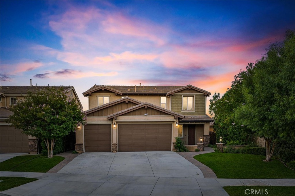 Welcome to Brightwood Place, a stunning NextGen home in one of Santa Clarita’s most sought-after newer neighborhoods - built in 2013, but no Mello Roos! Nestled in a quiet cul-de-sac, this expansive residence offers 4 bedrooms, 4 bathrooms, a 3-car garage, and a private ground-level NextGen suite with separate kitchen—perfect for multigenerational living or generating rental income at market rates of $2,200+ per month. A charming front courtyard, surrounded by lush greenery and a serene sitting area, provides a warm welcome before stepping into the inviting front family room that seamlessly introduces the home’s open-concept design. The gourmet kitchen is a chef’s dream, featuring an oversized granite center island, stainless steel appliances, a walk-in pantry, and recessed lighting. Plantation shutters throughout add a touch of sophistication, while the spacious dining and living areas showcase a cozy fireplace framed with stacked stone and a matching stone mantel—creating an elegant yet inviting space for gatherings. Upstairs, a grand loft offers endless possibilities as a home office, gym, second living area, or an easy conversion into a fifth bedroom. The expansive primary suite boasts breathtaking views and a spa-like ensuite with a soaking tub, separate standing shower, dual vanities, an additional makeup vanity, and a generous walk-in closet. Thoughtfully designed for convenience, this home features wide doorways, spacious secondary bedrooms with custom-built closet shelving, and an upstairs laundry room with abundant linen storage. The private NextGen suite, located on the first floor with its own entrance, offers a bedroom, full bathroom, kitchenette, dining area, laundry, and living space—along with sliding glass doors that open to breathtaking backyard views. This retreat is ideal for guests, extended family, or rental opportunities. Step outside to a backyard oasis designed for both relaxation and entertainment. A sprawling covered patio with a built-in fireplace sets the stage for cozy evenings, while the fully equipped BBQ island—complete with a sink and refrigerator—makes hosting effortless. A picturesque pergola with a second gas fireplace overlooks the serene, undeveloped landscape, enhancing the tranquil ambiance of this exceptional outdoor space. This energy-efficient home is equipped with fully owned and upgraded solar panels (14), a tankless water heater, and AT&T fiber internet with CAT5 wiring.
