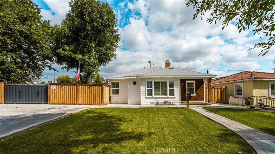 Located in 5 minute walking distance of historic downtown Upland is a picture perfect home situated on a 10,200 square foot lot. The home has been upgraded over the years and beautified throughout ownership! The interior of the home features a gorgeous fireplace, oak hardwood floors (throughout), wainscoting, built in shelving. The home’s kitchen features spacious shaker style cabinets, quartz stone, penny tile backsplash, floating shelves, custom 5 burner gas stove with convection oven and stainless steel vent hood and a built in breakfast nook off-of the kitchen perfectly completes this space! Full bath has been tastefully upgraded with wainscoting, tile flooring, vanity,barn-door mirror medicine cabinet, built-in storage cabinetry and marble counter. Half bath is equipped with newer sink, fixtures, custom paneling, and casement window. The two guest bedrooms are large-in-size with craftsman style crown-moulding. The main bedroom is cozy with wainscoted walls, a one of a kind barn door closet and French doors that let soft morning light into the room from the backyard. Access THE DREAM deck  &  back yard through the French doors off the main bedroom or kitchen and take it all in!  YOU WILL APPRECIATE EVERYTHING from the MASSIVE covered deck featuring space heaters to the CUSTOM-BUILT bar area equipped with built in BBQ, custom sink, refrigerator and 30-amp panel. 2 car detached garage with built in storage shed, custom mechanic clean-up station, and electric mechanical gate. Here, there is parking for all the toys!  Front or back, YOU pick!  The backyard also features a 10x12 storage shed with a finished interior that can be used as a home office, gym or storage. Newer HVAC system, digital thermostat, whole house fan, exterior siding, dual paned windows, plantation shutters, insulation, tankless water heater, cedar fence, newer roof replaced in 2023, upgraded sewer, 200-amp panel, and 100-amp sub panel and underground wiring. Wired for jacuzzi! This house is ONE OF A KIND in the Upland area and worth seeing.