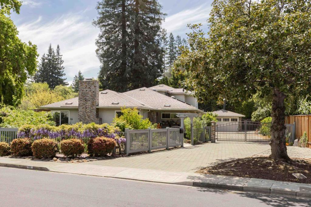Set on a peaceful street in Atherton, this spacious and sunlit home offers a rare opportunity to enjoy the comfort and privacy of one of the country's most exclusive towns, with a layout that works just as well for everyday living as it does for entertaining. Thoughtful updates blend with classic touches like hardwood floors and detailed millwork, while large living spaces flow easily from one to the next, including a comfortable family room, eat-in kitchen, and a warm living room with fireplace. Five bedrooms provide plenty of flexibility, and the backyard has space to host friends or enjoy the outdoors at your own pace, complete with a saltwater lap pool. Extras like AC, solar panels, and a Tesla Powerwall and EV charger add comfort and efficiency. All just a short walk to Holbrook-Palmer Park, with easy access to downtown Menlo Park, Palo Alto, Stanford, and top-rated Menlo-Atherton High (buyer to verify eligibility).