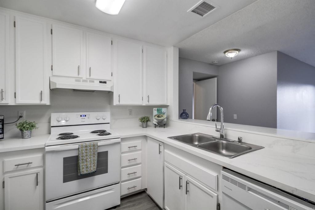 Welcome to 3955 Faircross Place, Unit 60 – a spacious and beautifully designed end-unit condo situated at the top of a breezy hill. This bright condo 2-bedroom, 2-bathroom home offers 1,134 square feet of comfortable living space and features vinyl plank flooring and new QUARTZ kitchen countertops, which is perfect for anyone seeking convenience, comfort, and style. This condo is equipped with a washer, dryer, dishwasher, and microwave—making everyday living a breeze. Built in 1985, the unit features TWO generous balconies that provide plenty of natural light and outdoor relaxation space. You'll enjoy the added security and ease of TWO assigned parking spots in a direct access secure/gated garage. Sunrise Point is nestled in the heart of San Diego and is close to shopping and mass transit. This home is located just 10 minutes from SDSU; 15 minutes from Balboa Park and Downtown San Diego. HOA fees include all water, trash and common area maintenance fees. Don’t miss this rare opportunity to own a well-maintained corner unit in a desirable location!