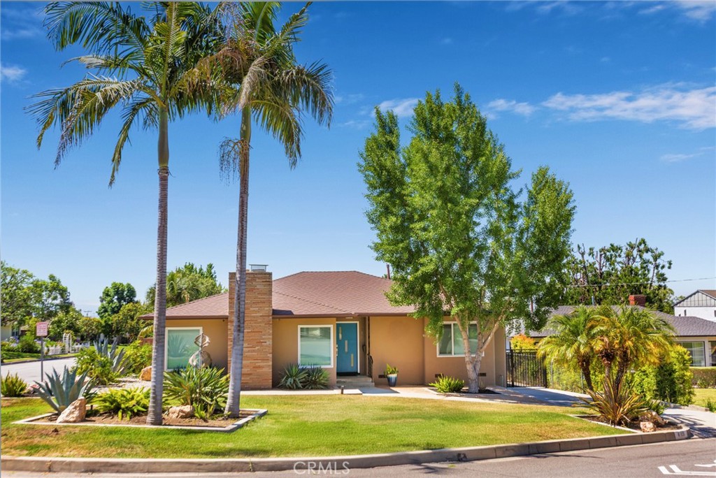 Extensive remodel completed in 2020, this beautifully maintained home offers modern amenities and stylish comfort in prime North Monrovia. The spacious and stylish kitchen is a true centerpiece, showcasing quartz countertops, soft-closing cabinetry, and a large island highlighted by unique pendant lighting. The family room and dining area with sliding glass doors open to a Trex deck—perfect for seamless indoor/outdoor entertaining. The living room welcomes you with a modern gas fireplace and picturesque mountain views, while engineered hardwood floors and recessed lighting add warmth and sophistication. Well designed floor plan includes 2 nice size bedrooms plus an additional office/den with a closet and laundry closet. Assessor shows 2 bedrooms and 2 baths but there is a 3rd room on the main level with closet and additional 3/4 bath downstairs; buyer to verify. The versatile basement offers a bonus room, closet, and ¾ bath. The main level bathrooms feature elegant tile flooring, quartz countertops, walk-in showers, and ultra-quiet Panasonic ventilation fans, combining style and function. Additional features include newer roof, dual-pane Milgard windows, tankless water heater, copper plumbing, a 200-amp electrical panel, drainage system with gutters, bolted foundation, and a security and camera system. Enjoy the outdoors in the beautifully designed, low-maintenance yard featuring an aluminum covered patio with bar, gas fire pit, built-in seating, two fountains, and durable Trex fencing. A long driveway leads to a two-car garage with ample space, including additional parking in the backyard. This is a rare opportunity to own an exemplary North Monrovia home where comfort, convenience, character, and style come together in perfect harmony.