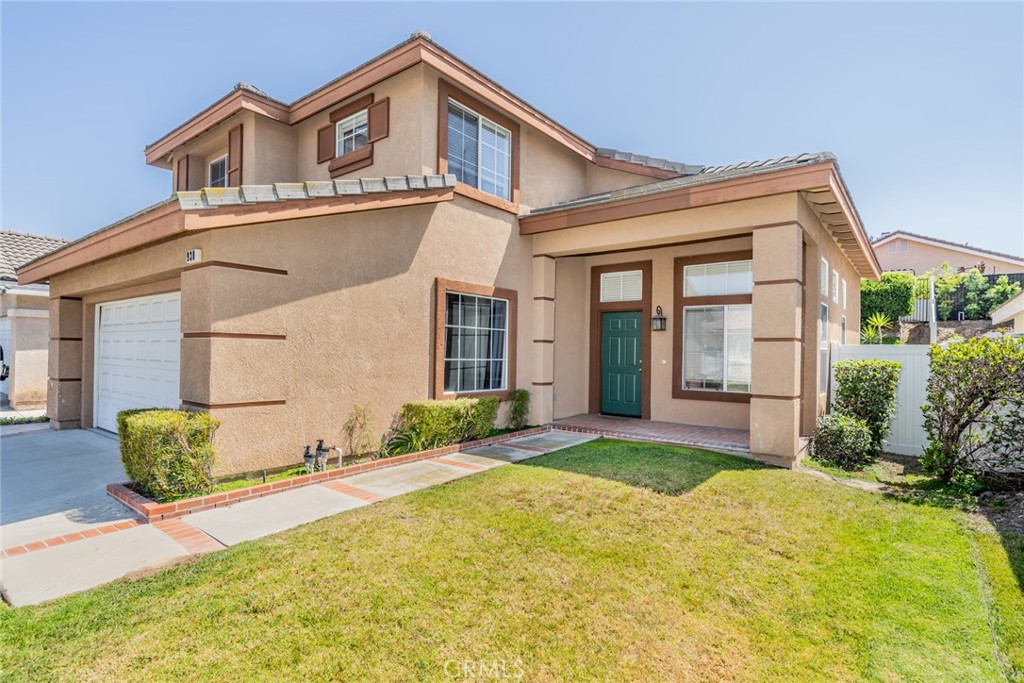 Welcome to 930 Ferndale Dr in Monteverde Estates.! The perfectly placed property within the Santiago High School Boundaries, offers everything you want in a home. Upon entry, you are greeted with big bright windows, a formal living room, and a formal dining room. Walking through the first floor is seamless as the luxury plank vinyl flooring moves from the front to the back of the home. The family room has a gas fireplace and opens up into the kitchen. The kitchen offers an shelf island that accommodates bar stool seating. Off the kitchen sits a quaint nook for those informal dining days. Stainless steel appliances, a range, and refrigerator stay with the property. The Second level offers a master suite, two bedrooms, and a tech space with cabinetry. The master bedroom is large, with an ensuite. The ensuite has a double sink vanity, a soaking tub and a walk-in closet. Home is within walking distance to the neighborhood park. Only minutes away from Freeway 15 and 91, The Crossings, and Dos Lagos. Great opportunity to make this home yours in the beautiful South Corona Community!