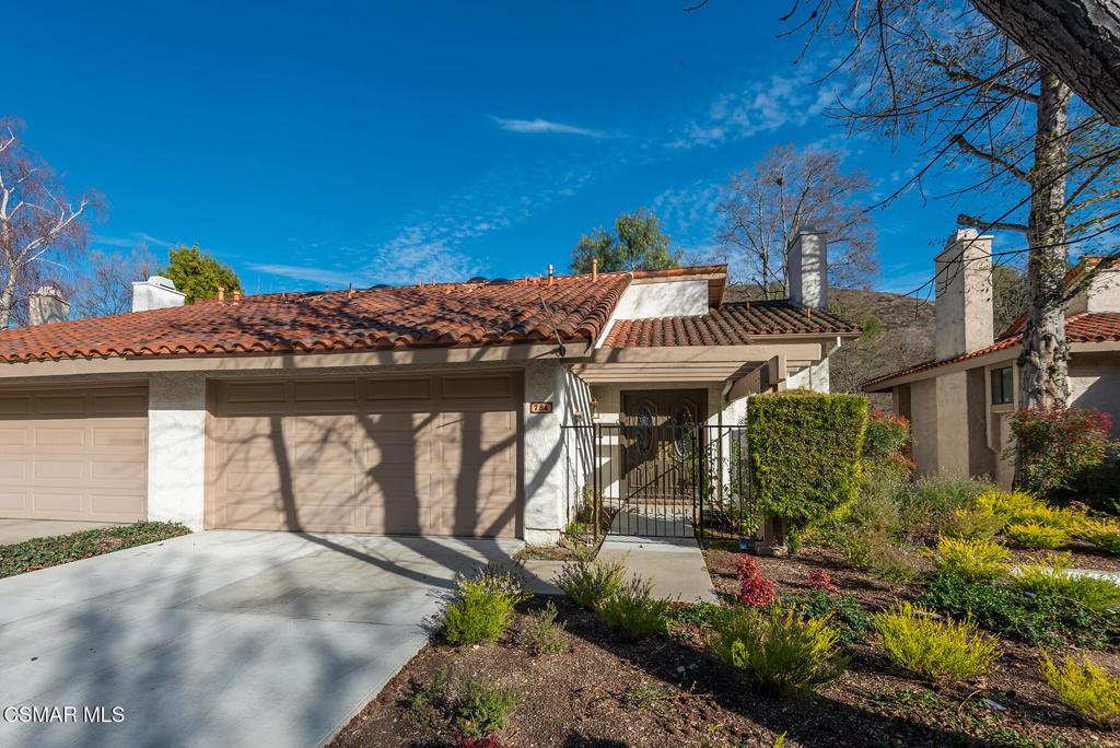 Nicely maintained home in the exclusive gated community of Northgate in Westlake Village. This 3+2.5 home features newly installed carpet, freshly painted interior and wood/like laminate flooring throughout. Private gated entrance with double door entry. Downstairs has large kitchen with tile counters, light wood cabinetry, white appliances, pantry and garden window overlooking back patio and open space. Living room with gas brick fireplace and oversized french slider to back patio. Separate formal dining room. Large family room with slider to backyard and views of trees and open space. Downstairs bath and indoor laundry area with washer and dryer included. Upstairs has huge loft area with vaulted ceilings and skylight. Primary bedroom has plantation shutters, ceiling fan and large slider to private balcony with beautiful views. Large ensuite primary bathroom with 2 separate vanities, oversized shower enclosure and walk-in closet with laundry chute. Nice size secondary bedrooms with large closets and slider/french door to balcony with views. Large upstairs bathroom with dual sink vanity and tub/shower. Backyard features large concrete patio and beautiful views of trees and open space. 2 car garage with driveway parking and new HVAC system installed. Gated complex includes pool, spa and surrounded by nature. Close to shops, restaurants, 101 fwy, and top rated schools! Come make it yours!