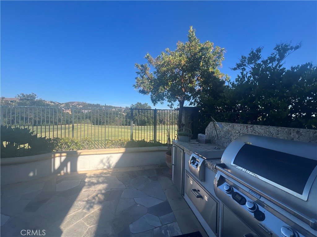 Panoramic view of the Coto De Caza golf course! Incredible Golf Course View! This gorgeous home is located at the end of a cul-de-sac and on a quiet street. The home has beautiful curb appeal! The nice curved driveway gives you a perfect opportunity to add an entrance gate at the street for privacy. It has a three car garage. Upon entering this home you are greeted by nice living room and upgraded dark hardwood floors is located in family room and an open floor plan. Beautiful wood cabinets and granite in kitchen with stainless steel appliances. Primary suite and primary bathroom has an amazing view plus three bedrooms upstairs and one room downstairs which could also be used as a bonus room or an office. Fabulous views of the golf course from both levels of this fantastic home. good sized lot. You can literally walk or drive your golf cart to the Coto de Caza Golf and Racquet Club. The equestrian Center is nearby, along with plenty of hiking trails and two community clubs. Come check out this amazing home in the 24 hour gated community of Coto. Coto de Caza is one of South Orange County's most exclusive guard gated communities and is near award winning schools including Serra Catholic, Wagon Wheel Elementary, Santa Margarita Catholic High School, Tesoro High School and more. Come experience all that 4 Castle Pines and Coto de Caza offer from spectacular homes to hiking, biking and horse trails, parks, sport courts, and membership opportunities at the Coto de Caza Golf & Racquet Club you will never want to leave.