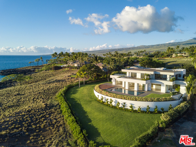 The Hapuna Beach Villa at Mauna Kea Resort ... The Big Island's ONLY estate from which you can walk barefoot to the best white sand beach in the State of Hawaii. This remarkable property exemplifies unrivaled craftsmanship and one of a kind architecture throughout. Sitting just above the beautiful white sand beach and greenery the villa is the epitome of beauty and serenity. This world class estate is a rare opportunity for an unparalleled island lifestyle offering indoor and outdoor living and entertainment. Ascending from the shoreline and lawns, the Beach Villa is an expansive four-bedroom, approx. 9,250 square foot oceanfront estate. The two story compound encompasses soaring ceilings, a grand staircase, wide hallways, and ample space throughout. Gathering and living spaces flow effortlessly together overlooking the private pool and sunning terraces. Views of dramatic vistas of ocean, mountain and neighboring islands are seen from each room.