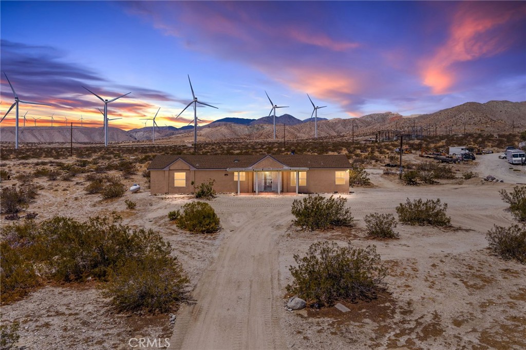 Welcome to 15815 Painted Hills Rd in Whitewater, CA – it’s a beautifully remodeled 4-bedroom, 2-bathroom home offering 1,900 sq ft of comfortable living space on a sprawling 5-acre lot just off Route 62. As you enter the home, you are welcomed to the open living of the living room, kitchen and dining room. The primary suite has an ensuite bathroom and views of the valley from the oversized tub. Some recent updates include tile flooring, tile counter tops fresh interior and exterior paint, and a variety of modern upgrades, creating a move-in-ready retreat with plenty of room to grow.
Enjoy peaceful desert living while staying close to it all – just 15 minutes from both Palm Springs and Desert Hot Springs, and about 40 minutes from the stunning Joshua Tree National Park. You can get a great view of Mt. San Jacinto just out the door. Whether you’re seeking a private getaway, or space for future projects, this home offers endless possibilities in a serene, picturesque setting.