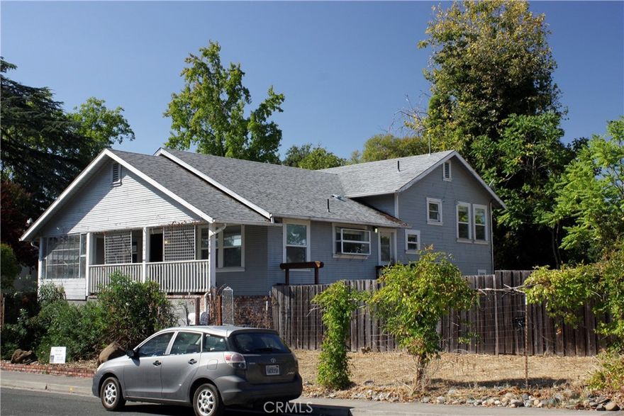 Located on a 0.26-acre corner lot, this tri-level single-family residence built in 1937 offers approximately 2,112 square feet of living space and includes 4 bedrooms and 2.5 bathrooms. The property features wood flooring, an enclosed front porch, a two-car garage with an attached workshop area, and is just about one block from the lake and within walking distance to downtown Lakeport.