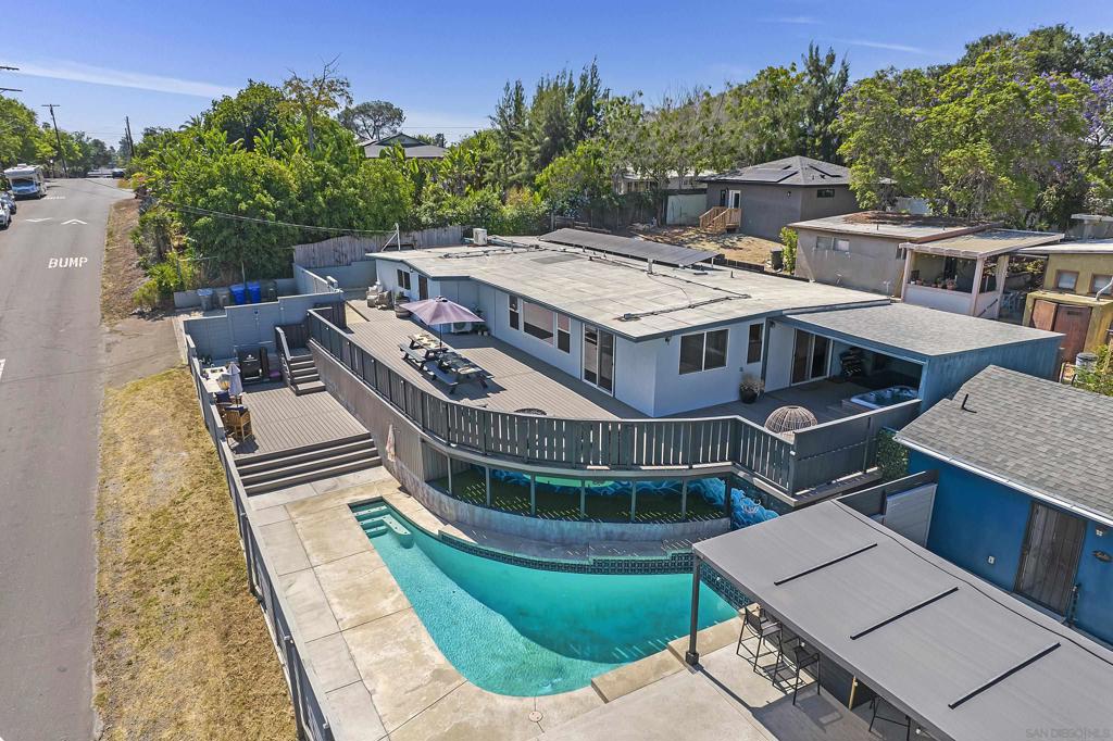 Over $400k in upgrades since 2020! The stunning, remodeled, 2,152 sqft main house has 4 BR / 2 BA and office (5th BR?) and offers a separate & private fully detached, permitted, 487 sqft. studio ADU w/ washer/dryer, exclusive use yard & driveway. Paid for solar. Designer eat in kitchen, huge outdoor deck and fully fenced outdoor area including a 17' x 10' outdoor kitchen equipped with MasterBuilt Gravity smoker, Bull BBQ / Side Burner & outdoor sink, swimming pool and 8' x 6' bar & seating area make this an entertainer's dream! This property is the perfect home for the indoor / outdoor Southern California lifestyle. Mature citrus trees (Blood/Navel Orange & Lemon) adorn the pristine grassy outdoor garden area. Large master bedroom w/ custom built closets for storage & new master bath. Spa & outdoor gym area (covered).