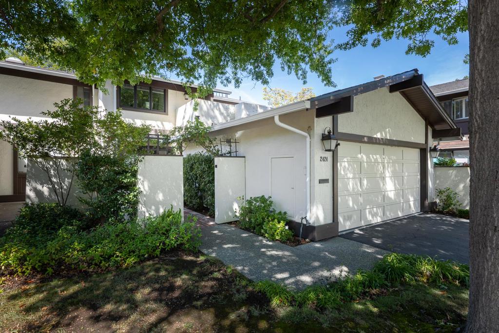 Beautifully remodeled and thoughtfully appointed, this spacious townhome is located in the sought-after Sharon Oaks community and offers the scale and lifestyle of a single-family home. With just one common wall and tucked away on a court, the home provides an exceptional sense of privacy on two levels. A private walkway leads to the covered entrance shared with the attached 2 car garage. The home has approximately 2,260 square feet with 3 bedrooms, a family room or 4th bedroom, and 2.5 baths. Highlights include richly hued wood floors, crown moldings, and ceiling lighting. A formal living room with gas fireplace and French doors to the secluded rear patio, a dining room with a modern chandelier, and a spacious eat-in kitchen with knotty pine cabinetry, colorful tile accents, and fireplace add character throughout. The upstairs primary suite features a sitting area with fireplace, customized walk-in closet, and remodeled luxury bath, while two additional bedrooms, a well-appointed bath, laundry, and a rooftop terrace complete the upper level. Two community pools and a clubhouse are nearby, plus access to acclaimed Las Lomitas schools and proximity to Stanford University and Sharon Heights Shopping Center.