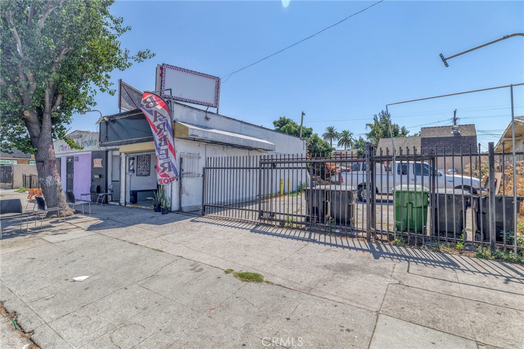 Unique opportunity to own a mixed-use property in a high-traffic location! This parcel features a commercial building, residential units, and parking lot - providing versatilty for investors or owner-users. The front commercial building is currently operating as a busy barbershop. Behind the storefront, you'll find a 2-bedroom, 2-bath residence. There is also an additional 1-bedroom, 1-bath accessory dwelling unit with potential for ADU renovation or expansion (status of permits unknown). Easy access to major freeways.