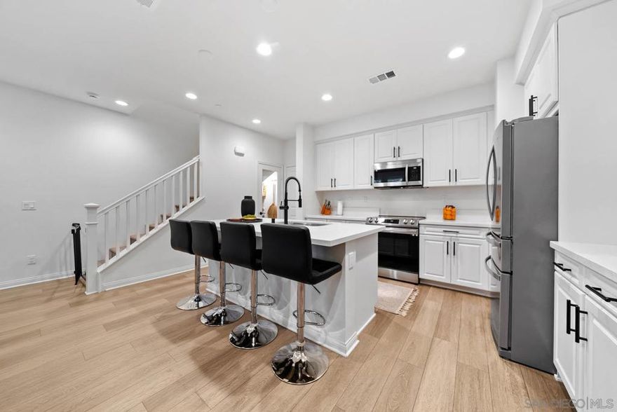 OWNED SOLAR. LIKE NEW. MOVE-IN READY. Spacious 3 bed 2.5 bath 2-story townhome in well-maintained complex nestled in the hills near Sweetwater Reservoir! Open & bright floorplan featuring modern kitchen with center island & breakfast bar, large walk in pantry, wide plank flooring throughout (No carpet), shutters throughout, neutral color palette and master retreat with spa-like bath. Inviting front entry with patio area. Complex features lush landscaping, pool and playground. Central location near parks, schools, shopping and dining! A must see!