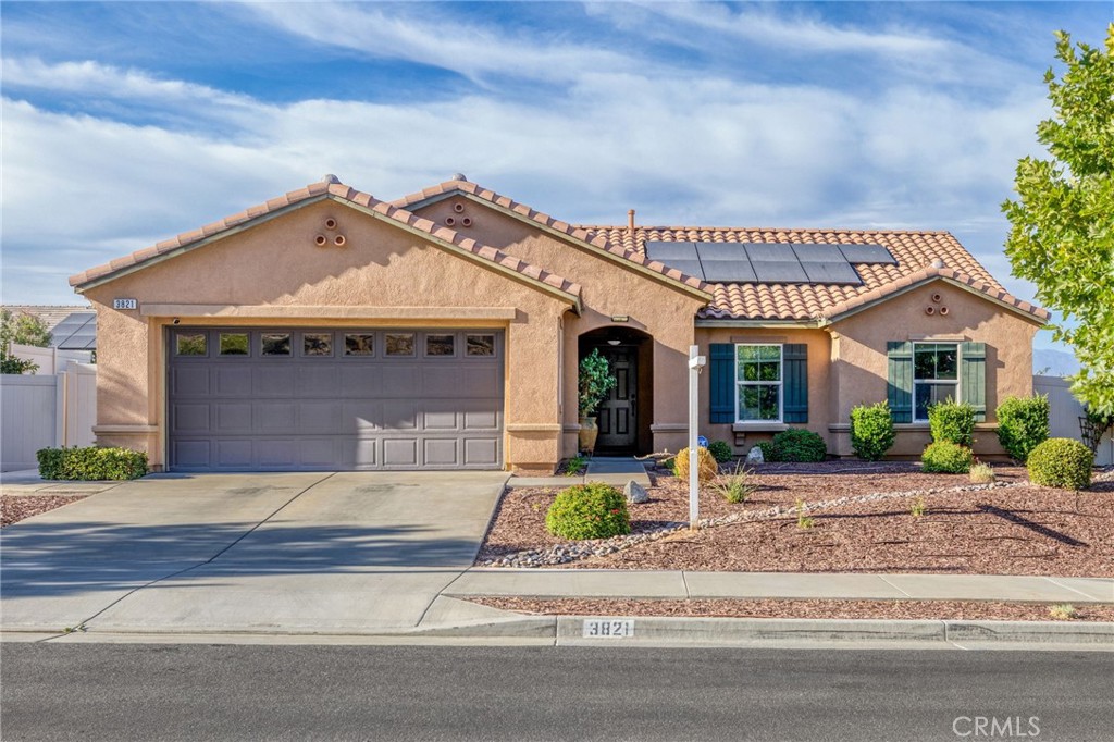 Located in a tranquil, well-kept neighborhood, this single-story home blends modern comfort with thoughtful upgrades. Inside, you’ll find an open concept layout that connects the kitchen, dining, and living areas, perfect for everyday living or entertaining. The kitchen features crisp white cabinetry, a large island, and plenty of prep space.
The primary suite includes a walk-in closet, dual vanities, a water closet, and a step-in shower. The secondary bedrooms offer ample living space while maintaining a clean and consistent design.
Out back, the covered patio provides shade throughout the year, with a manicured lawn and raised planters offering just the right amount of space to enjoy or entertain. The home also features solar, a two-car garage, and low-maintenance landscaping in front.
Nearby, you’ll have easy access to The Cove Park with basketball courts, a baseball field, and a playground. Within this beautiful community, you’ll also find walking trails, smaller neighborhood parks, and open space for those who enjoy staying connected to nature, neighbors, and local amenities.