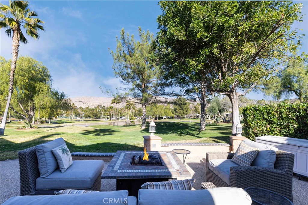Welcome to Rancho California RV Resort **LOT 246** PREMIUM location overlooking holes 1 and 2 with amazing water, mountain and golf course VIEWS safely out of golf ball range! Lot features spacious alumawood patio cover with full screen enclosures. Interior of buildout boasts solid privacy screens, bbq grill, cooktop, refrigerator, sink, pebble tech finished flooring, two large mounted flat screen TV's and stainless cabinet storage drawers. The rear patio is finished with pebble tech and features a variety of spaces for dining and conversation lounge area with fire table while entertaining family and friends or just relaxing soaking up the breathtaking VIEWS. Overall, lot is spacious and accommodates large rigs with plenty of space for golf cart and vehicle parking. This property provides a buyer with an opportunity for a turn key package deal to include Mobile Suites 391/2 BDRS3 fifth wheel and custom stairs for $250,000. Come check out this perfect location nestled among the foothills of Palomar Mountain, minutes from Temecula Wine Country as well as a convenient location to Palm Springs in just under an hour, 1.5 hrs to San Diego and 1 hr to the beach in Oceanside. Rancho California RV Resort provides amenities such as a 14 hole Executive PAR 3 Golf Course (no fees for owners), 5 Pools/Jacuzzis, Tennis courts, Pickleball courts, Dog park, Club house, hiking trails, Horseshoe lawn and onsite restaurant and grocery market. The resort is guard gated with no age restrictions. Monthly HOA fee includes use of the golf course, amenities, trash pickup at lot, water/sewer, cable TV and common area maintenance. If you are considering a premier Southern California RV destination, don't miss out on visiting Rancho California RV Resort - schedule a showing today! Financing Available....