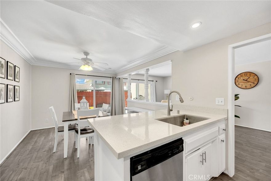 Tastefully upgraded 3-bedroom, 1.5-bathroom townhome in the highly desirable Tanglewood community of Cypress! This home features a brand-new AC unit, new dual-pane windows throughout, and a remodeled shower for modern comfort and efficiency. Upon entry, you're welcomed by sprawling laminate floors and fresh paint. The kitchen boasts quartz countertops, updated hardware and fixtures, and recessed lighting, flowing into a dining area with a large window for natural light. The spacious living room opens to a private patio with two large storage closets, perfect for entertaining. Downstairs also includes a convenient half-bath and a dedicated laundry room. Upstairs, all three bedrooms offer new carpeting, mirrored wardrobes, and ceiling fans. The full bathroom includes a modern vanity, newer laminate flooring, and a remodeled shower/tub combo. Enjoy two side-by-side carport spaces and access to fantastic community amenities including 3 pools, 2 wading pools, 3 playgrounds, 2 clubhouses, and beautifully landscaped walkways and greenbelts. Conveniently located near parks, grocery stores, restaurants, and within the award-winning Cypress School District. Come experience the charm and comfort of Tanglewood living!