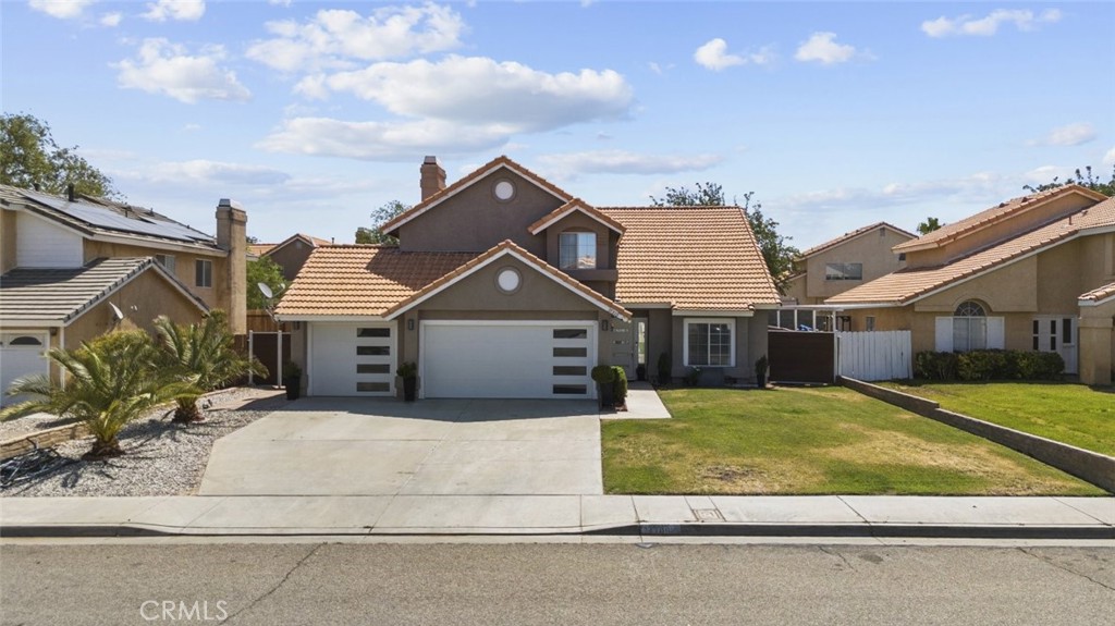Spacious 4 bedroom, 3 bathroom home with over 2000 square feet of living space in the heart of Palmdale. This well-appointed residence features updated appliances, laminate flooring, recessed and natural lighting, and both a living room and family room for versatile living. The full kitchen is bright and functional, offering ample space and style. All bedrooms are generously sized, including a primary suite with its own private balcony patio. A cozy fireplace adds warmth to the living area, and the expansive backyard is perfect for outdoor enjoyment or entertaining. This is a must-see home offering comfort, space, and convenience.