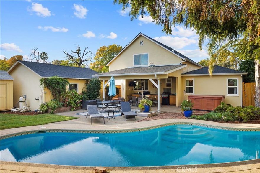 Welcome to this beautifully updated 4 bedroom, 3 bathroom Chico home located in the wonderful Barber district. From the inviting front porch to the remodeled kitchen and original hardwood floors in the dining room and bedrooms, this home blends timeless character with many recent updates.

Inside, you’ll love the extra-large living area and the remodeled kitchen. There is an upstairs bonus room (possible 4ht bedroom!) with its own bathroom.  Step outside and discover your very own summer sanctuary built for entertaining! Enjoy a covered patio with a full outdoor kitchen featuring a stove, BBQ, deep sink, TV, speakers, and ceiling fan. Cool off in the inground gunite pool (refinished 3 years ago), unwind in the spa, rinse off in the outdoor shower, or relax by the waterfall feature with plenty of seating for family and guests. The backyard also includes raised garden beds, a lawn area, side yard, shed, sprinklers, and an oversized one-car garage equipped with a utility sink, washer, dryer, shelving, and workspace—plus a long driveway offering plenty of off-street parking. Conveniently located near downtown, restaurants, shopping, and more, The home has just had a brand new roof as well as landscaping with an automatic irrigation!