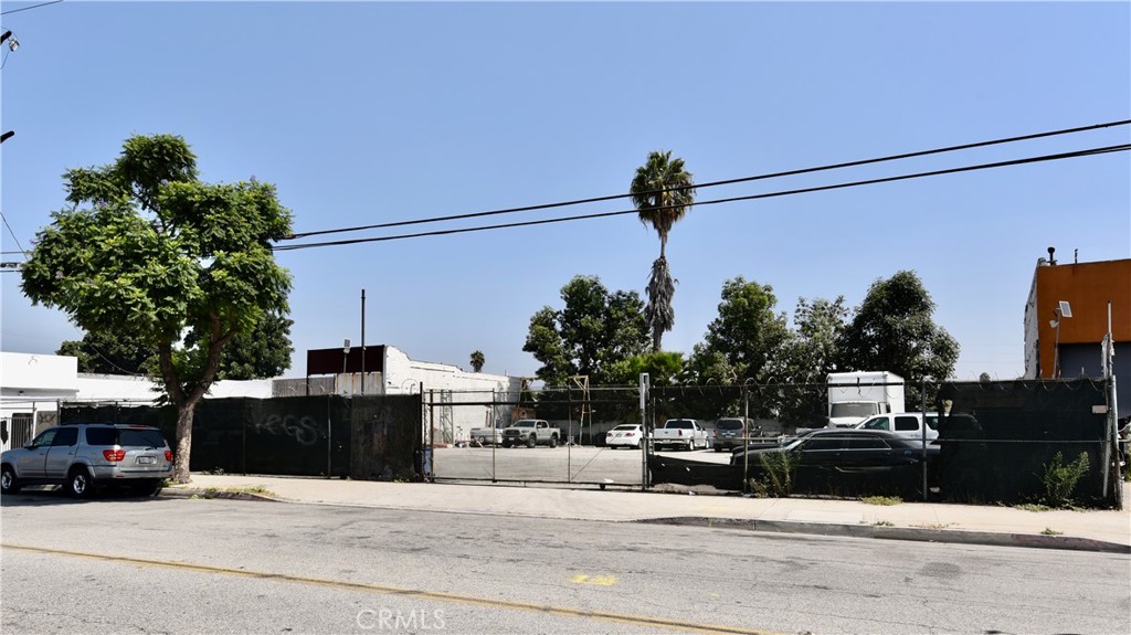 Excellent Investment Opportunity in the Alameda Corridor! Don’t miss this rare chance to own three adjoining parcels totaling 50,710 sq. ft. (over 1 acre) of land, zoned COML, in the highly desirable Alameda Corridor. The property is currently operating as a parking lot for semi trucks, tenant is on month-to-month agreements—offering flexibility for investors or owner-users. Conveniently located just minutes from the 105, 710, and 405 freeways, and directly in front of the rail expressway, this prime location provides exceptional accessibility and visibility. Addresses of all 3 parcels that are for sale are : 134 S Alameda, 142 S Alameda, and 200 S Alameda. All three parcels are being offered together for $5,999,000. Appraised in 2024 for $7,000,000—this is a fantastic opportunity to build, expand, or invest. With all 3 parcels you have a total of 460 feet of street frontage. The other MLS numbers are DW25216009 and DW25216036