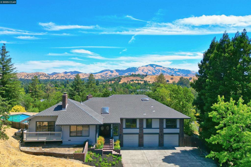 VIEWS!! A one-of-a-kind Estate in Tice Valley with Mt. Diablo Views! 3,600+SF on a serene and private .87 Acre lot at the end of a cul-de-sac. Masterfully built in 1980, this spectacular updated 5BD/3.5BA home features custom redwood vaulted ceilings, beautifully refinished Oak hardwood floors, new carpet, dual pane windows, 2 zone hvac and 3+ car garage. The newly updated kitchen has white cabinetry, Quartz counters, center island, new LG appliances including two ovens, wine fridge, convection microwave and recessed LED lighting. The family room has a stone fireplace, updated wet-bar and patio door to the backyard with views of Mt. Diablo. The spacious formal living and dining rooms are filled with natural light from the surrounding view windows. The primary bedroom has Mt. Diablo views, private balcony, vault ceilings, walk-in closet and updated full bathroom with dual sink vanity, jetted tub and separate shower. There are 3 additional bedrooms on the main floor. The ground level is perfect for an au-pair/in-la or guests as it features a level entry bedroom and bathroom. The .87 acre lot features a large swimming pool and spa, level yard areas, fruit trees and breathtaking views of Mt. Diablo and the surrounding area. Walnut Creek School district.
