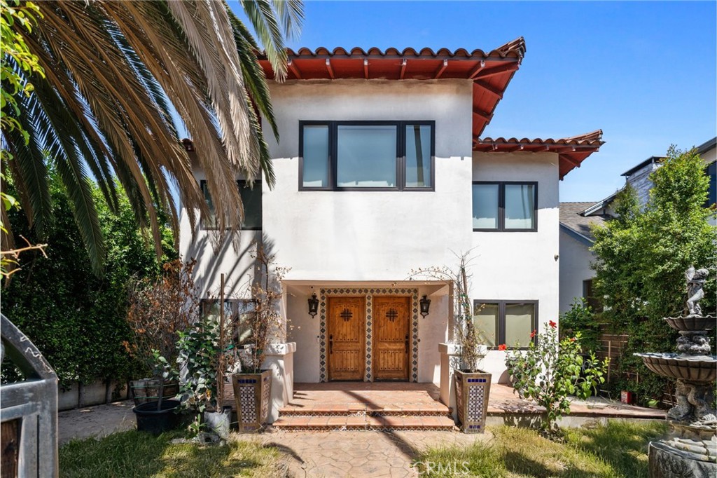 Set on one of Echo Park’s most iconic palm-lined streets, this 1921 Spanish-style duplex offers a rare opportunity to create something extraordinary. Elevated on a spacious 7,000+ square foot lot, the property captures breathtaking city views—including the Griffith Observatory and Hollywood Sign—while offering privacy, character, and serious upside.
The structure features two units: the upper unit has been partially framed out with newer windows and updated systems, while the lower unit remains largely unfinished. Both spaces are vacant and ready for your transformation. Whether you’re an investor looking to maximize rental potential or a creative homeowner dreaming of converting the top unit into a single-family residence with a rear ADU (buyer to verify), the layout and lot size provide unmatched flexibility.
Classic Spanish details like wood beams, arched entries, and colorful tilework hint at the home’s original charm, while the exposed framing, open floorplans, and improved infrastructure invite a modern reimagining. The gated lot includes a private driveway, terraced patio, lower sport court, and plenty of outdoor space to entertain or expand.
Located just minutes from Elysian Park, Dodger Stadium, and Echo Park’s best shops, cafés, and hidden trails, this address blends old-Hollywood hillside vibes with endless opportunity. Whether you're restoring, rebuilding, or developing, this is a blank canvas in one of LA’s most beloved neighborhoods.