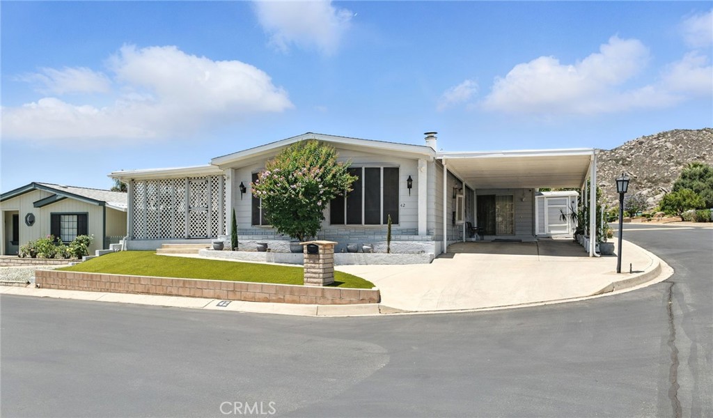 Opportunity awaits in the desirable 55+ Maze Stone Village community, where serenity meets city convenience. Nestled on a quiet corner lot, this charming 2-bedroom, 2-bath manufactured home, built in 1979, offers a functional layout with generous living and dining areas, coupled with a low maintenance yard. The home is surrounded by mature trees and showcases peaceful mountain views, creating a serene environment for daily living. Maze Stone Village is known for its quiet streets, welcoming neighbors, and access to community amenities including a clubhouse. With proximity to shopping, dining, and healthcare, this location offers the best of both worlds—tranquil living with easy access to everything you need. This is an excellent opportunity for affordable California living in a well-cared-for senior park. Don’t miss your chance to make this home your own.