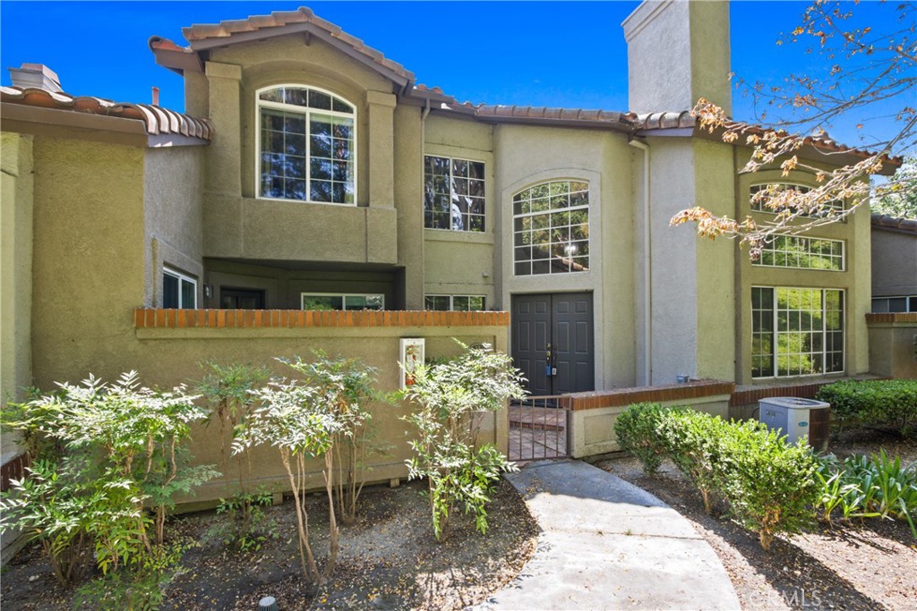 Welcome to Windflower ~ A Beautifully Remodeled Home in the Heart of Aliso Viejo Nestled in the highly sought-after Windflower community, this impeccably updated residence offers a blend of comfort, style, and convenience. With 2 generously sized bedrooms and a spacious loft overlooking the main living area, the open-concept layout is enhanced by cathedral ceilings, abundant natural light, and a cozy fireplace that anchors the living space. The bright, white kitchen is both functional and inviting — ideal for everyday living or entertaining. Step outside to a charming front courtyard, perfect for relaxing or enjoying your morning coffee. The attached garage features epoxy flooring, adding a clean and modern finish. Enjoy the beautifully maintained community grounds filled with mature trees and lush landscaping, along with amenities that include a resort-style pool, children’s play area, and more. Just a short walk to Woodfield and Springdale Parks, this location offers the perfect balance of privacy and accessibility. Whether you're searching for a primary residence or a refined retreat, this Windflower home delivers exceptional living in one of Aliso Viejo’s most desirable neighborhoods.