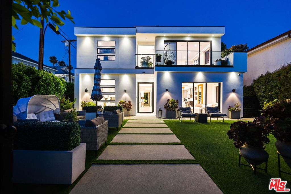 Welcome to this stunning contemporary residence nestled in one of Studio City's most sought-after neighborhoods. This home built in 2021, features an open-concept floor plan filled with natural light, high-end finishes, tech savvy, and designer touches throughout. Each bedroom is generously sized, with en-suite baths providing privacy and comfort, including a lavish primary suite with a walk-in closet and spa-style bathroom featuring a soaking tub and dual vanities. The gourmet chef's kitchen features high-end stainless steel appliances by Miele, Thermador, and Sharp, as well as quartz countertops, custom cabinetry, and a large center island. The spacious living and dining areas open up to a beautifully landscaped backyard and front yard complete with a pool and spa, and lush greenery your own tranquil oasis in the heart of the city. A detached garage adds flexible potential for an office, studio, or ADU. Prime Location: Situated within the top-rated Carpenter Charter school district. Just minutes from the Studio City Farmer's Market, where you can enjoy fresh, local produce and weekend charm. A short stroll to Ventura Blvd's trendy restaurants, cafes, and boutique shops. Additional highlights include engineered hardwood floors, smart home features, a high-end security system, smart blinds, paid off solar, and a security gate with call box, a detached garage, EV charging station in the garage and designer finishes throughout. Don't miss this rare opportunity to own a move-in ready luxury home in the heart of Studio City.