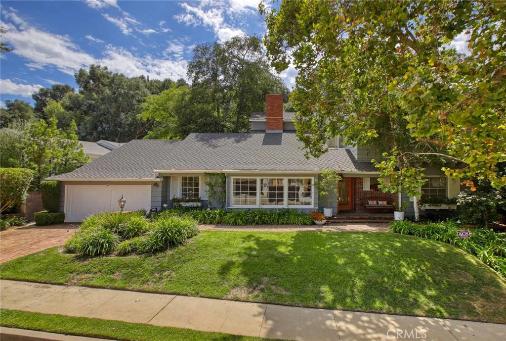 Welcome to this light-filled traditional residence with mid-century flair in coveted Royal Woods. Timeless design meets contemporary comfort. Natural light pours throughout the house, highlighting soaring ceilings, expansive windows, and open living spaces that seamlessly connect indoors and outdoors—California living at its best.
The main level offers an elegant formal dining room with fireplace, a welcoming family room with wet bar and French doors to the backyard, and a chef’s kitchen with center island, granite counters, Sub-Zero, and a breakfast nook.
Upstairs, the luxurious primary suite feels like a private retreat with a fireplace, private balcony, built-ins, and extraordinary walk-in closets. The spa-inspired bath features skylights, dual vanities, a soaking tub, and glass-block shower. Additional bedrooms are generously sized, each with walk-in closets. The upstairs guest bedroom also enjoys private bath, vaulted ceilings and abundant natural light.
Designed for entertaining, an integrated sound system flows throughout the home. The backyard includes a spacious brick patio, spa, and pool surrounded by lush greenery for ultimate privacy. A rare opportunity in a premier Sherman Oaks neighborhood—ready to be reimagined into your forever home.
Trust Sale...hurry...won't last.