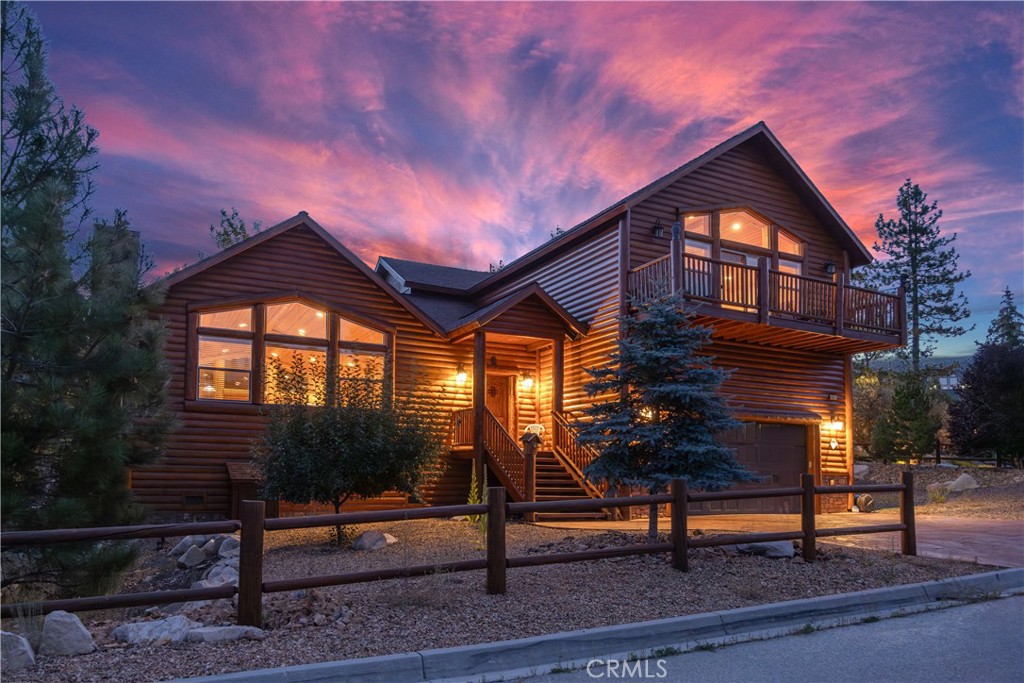 Experience the charm and warmth of mountain living at its finest with this captivating home at 421 Morningstar Place, nestled in the desirable Castle Glen neighborhood of Big Bear Lake. This log-style gem offers a perfect blend of rustic elegance and modern comfort, boasting 4 spacious bedrooms and 3 well-appointed bathrooms within a generous 2,593 square feet of living space. Positioned on a beautifully landscaped 9,000 square foot corner lot, the property welcomes you with its inviting cabin feel and scenic views of the surrounding trees and mountains. Step inside to discover a great room featuring vaulted T&G pine ceilings, stunning log accents, and distressed wood flooring, all centered around a cozy rock fireplace. The open kitchen is a chef's delight, with granite countertops, stainless steel appliances, and a unique breakfast bar great for gatherings.Whether you're looking for a full-time residence, a second home, or an income property, this furnished home offers versatility and potential. Enjoy the convenience of being near local stores, restaurants, ski resorts, and the picturesque lake. With added luxuries like a spa, air conditioning, a game room, and a master suite with a gas log fireplace and view balcony, this home is an ideal retreat for relaxation and entertaining. Don't miss the opportunity to make this exceptional property your own sanctuary in the mountains. Contact us today to arrange a personal showing and explore the endless possibilities.