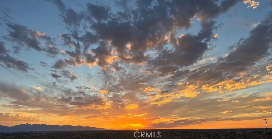 Dark night skies, brilliant sunsets, exquisite mountain views, and twinkling city lights await you on this one-of-a-kind homesite. Perched high above the sparsely populated ranchettes below you, this 5.39 acre lot features the best 180 degree views in the Marianas. Nestled at the base of a hillside, the homebuilder will have over 1 acre of useable land to work with, and a bonus area above where a second pad can be cut...or you can seek a lot split and sell that off to help fund the build (subject to approval of course). A large level pad already exists. Peaceful country living but only ten minutes from everything you would need. No piped water. Electricity nearby.