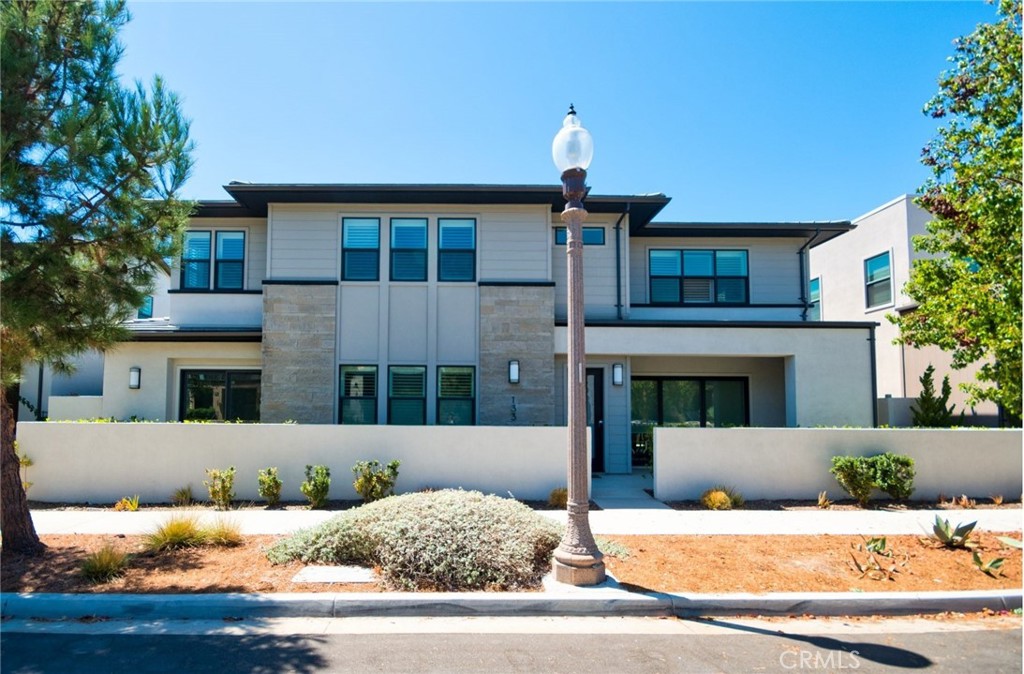 Welcome to this Stunning Single Family Home in the Coveted Great Park Community! This beautifully upgraded home features a spacious 3,360 sqft open floor plan with 4 en-suite bedrooms, 4.5 bathrooms, and a thoughtful layout designed for comfort and entertaining. The main floor boasts luxury vinyl flooring, recessed lighting, and an inviting guest suite with a full bath. The heart of the home is the chef-inspired gourmet kitchen, fully upgraded with quartz countertops, full tile backsplash, a large island, custom cabinetry, and premium stainless steel appliances—perfect for culinary enthusiasts. Upstairs, enjoy a generous family room ideal for movie nights or gatherings. The primary suite offers a private retreat with a spacious bathroom and a personal balcony deck. Two additional bedrooms each feature private full bathrooms and the upstairs laundry room is equipped with a utility sink and ample cabinet storage for added convenience. Modern grey-toned carpet throughout the second floor adds warmth and style. Community Amenities: Residents enjoy access to world-class amenities including: 17 pools, 9 parks, top-rated schools, and miles of trails and just minutes to Wood-bury Shopping Center, Irvine Spectrum, John Wayne Airport, and major freeways (I-5, 241, 133 & 73). This home offers the perfect balance of luxury, lifestyle, and location.