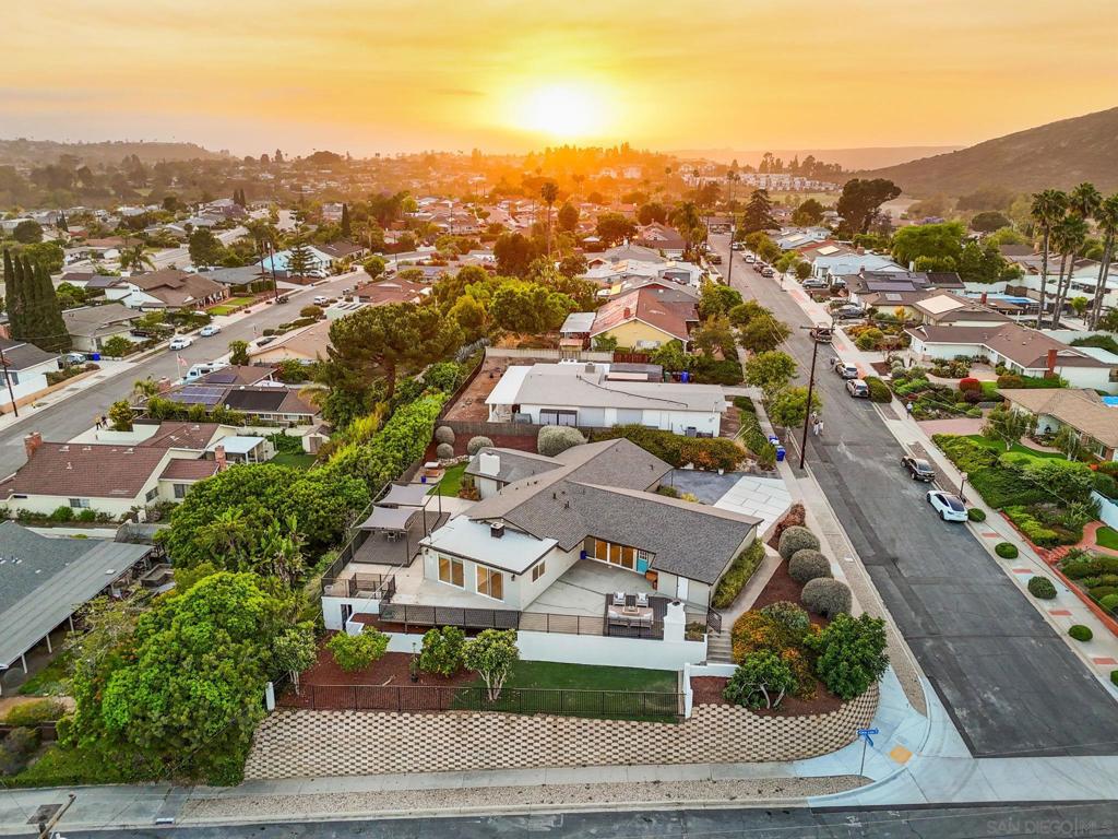 San Carlos Showstopper with Endless Views! An exceptional 5-bedroom, 2-bathroom corner lot home in the heart of San Carlos—just steps from Cowles Mountain, Mission Trails, Lake Murray, and top-rated schools. With nearly 2,500 sq ft of upgraded living space on a generous 13,300 sq ft lot, this home combines thoughtful design and breathtaking views, perfect for those seeking their forever home. The heart of the home is a chef-style kitchen featuring a large smokey quartz island and countertops, stainless steel appliances, crisp white shaker cabinets, and a glossy ceramic subway tile backsplash—a space made for gathering, hosting, and everyday living. The open layout flows into two spacious living areas: one bathed in natural light with panoramic views of Cowles Mountain and Mt. Helix, and another with a gas fireplace and serene views of the backyard—perfect for cozy evenings. Step outside to enjoy multiple decks, ideal for sunset dinners, morning coffee, or entertaining. Gather around the wood-burning fireplace to enjoy drinks, appetizers, or make s’mores while sharing stories of your sun-soaked San Diego day. The turf lawn and mature lemon, fig, and loquat trees create a private backyard paradise. The primary suite offers a tranquil escape with a walk-in closet, dual-sink vanity, spa-style shower, and a private deck accessed through sliding glass doors—perfect for a quiet morning retreat. Enjoy ample side parking for a trailer or boat. With views, upgrades, and an unbeatable location, this home truly is the entire package. See it today before it's gone!! Buyer to verify all including but not limited to square footage, lot size, property boundaries, zoning, permits, school district, and the accuracy of MLS data. Broker and agent do not guarantee the accuracy of information provided buyer to verify all.