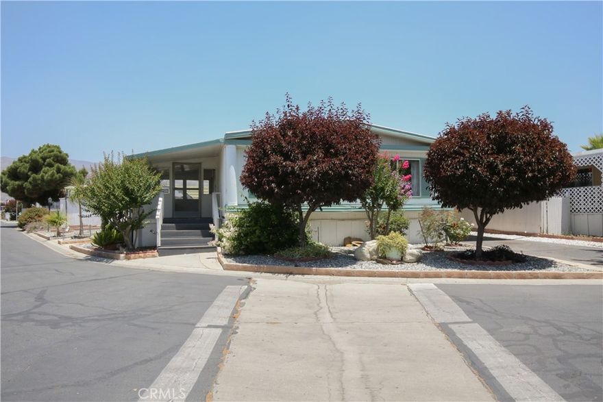 *Back on Market* Searching for your next spot in San Jacinto in a 55+ Community? Look no further as this property might just be the one you are looking for! It comes with covered parking that can perfectly sit 2 vehicles and a quaint front garden that adds appeal to this corner-lot home. Unlike most manufactured homes, this abode has plenty of room to relax and entertain! The front side is a nice sun room where you can hang out with your family and friends, or simply read your favorite book while sipping your morning tea. Inside, there is a good-sized living room where you can also see a view of the kitchen (talk about not missing out on any action!). The kitchen comes with plenty of storage cabinets and is equipped with the necessary appliances for your convenience. Apart from the central AC, there are ceiling fans peppered throughout to keep you cool and comfy especially during summer. All of the bedrooms are well-maintained and come with capacious closets, giving you enough room for family or guests. There is a dedicated laundry area, too, making washing and drying a breeze. Situated near major roads and having access to fantastic amenities such as the pool, dog parks, and recreation areas, this home is not to miss!