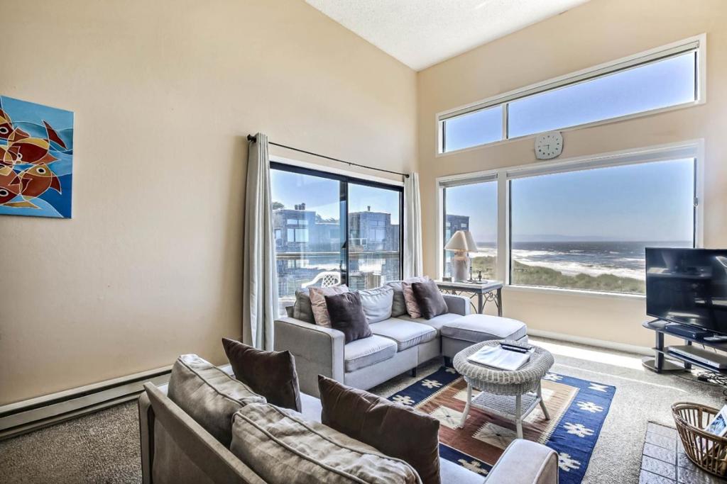 PICTURE THIS: LAYING IN BED OR RELAXING IN A COUCH IN THE LIVING ROOM AND LOOKING AT WAVES, THE BEACH, SUNSET ALL FROM YOUR HOME - ALL DAY AND ALL NIGHT LONG!! Stunning ocean views from the living room and the front bedroom. Step on to the deck outside the living room and master bedroom -- spectacular views of the ocean and beach, you can see occasional dolphins, jumping in the water closer to sunset. What is between you and the water? Just a flight of stairs down to the private beach from your beautiful home. You can have your own bonfires on the private beach designated only to the owners. Its a fully furnished 2 bedroom and 2 bath condo with an in unit laundry. Being on the 3rd floor gives you long and wide views of the ocean. You must be wondering, can I/we afford this ocean-view home? The HOA allows short term rentals, you can offset your ownership costs by renting out the condo. Send photos or livestream the jaw-dropping beach and ocean views to your soon-to-be-jealous co-workers. The complex has walking trails along a small duck pond (little kids love that), you can do birdwatching, play tennis, pickleball, and basketball. Want to party and invite a large number of friends? A private party room available for the owners to reserve for guests on the property.
