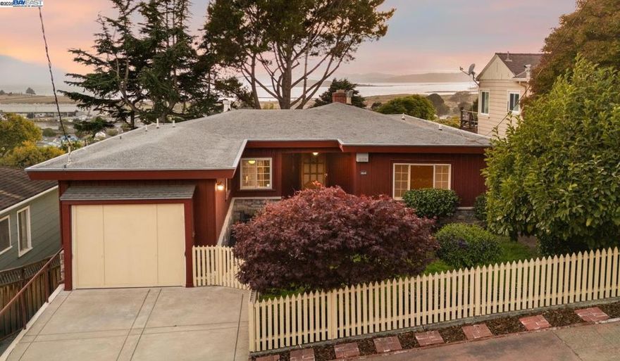 What a “Butte,” complete with panoramic Bay views and abundant space! Located in the highly sought-after Richmond Annex and just blocks from El Cerrito, 1623 Butte St. welcomes you with a gated, landscaped front yard framed by Japanese maple and magnolia, and citrus trees. Don’t let this unassuming home deceive you- it boasts 2,651 sqft filled with natural light & offers a leveled-in main entry with 3 bedrooms and 2 full bathrooms. The living and dining rooms showcase picturesque windows with stunning bridge Golden Gate, SF skyline, Bay views—the perfect backdrop for golden hours or cozy evenings by the fireplace. The updated kitchen features ample cabinetry, stainless steel appliances, and quartz countertops. The spacious primary suite includes a vintage-inspired en-suite with spa tub, 2 additional bedrooms with hardwood floors share an updated bath. Downstairs expands the possibilities with a large multipurpose room, decorative fireplace, bedroom, full bath, laundry, refinished hardwood floors, new lighting and fresh paint. The two-level enclosed backyard is ideal for entertaining or relaxing, while the unfinished basement offers untapped potential. Served by El Cerrito Unified Schools (buyer to verify) and close to El Cerrito Plaza, BART, Pt. Isabel, Pacific East Mall, I-80