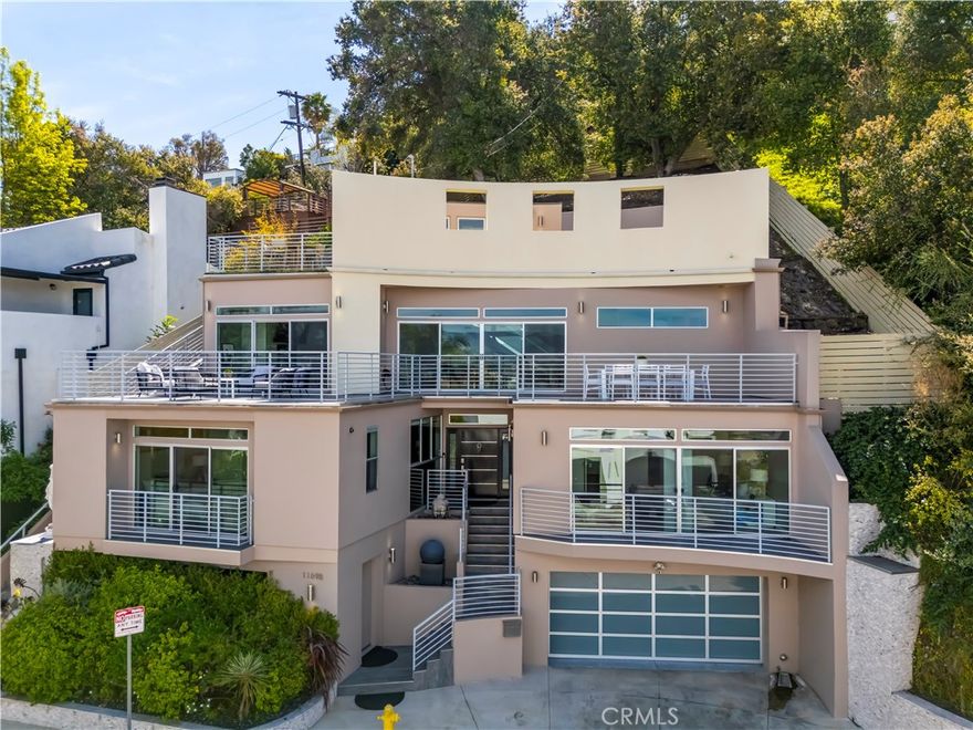 Stunning Luxury Modern Oasis in Studio City

Welcome to 11698 Picturesque Drive, a sophisticated blend of luxury and modern living perched in the heart of Studio City. This architectural masterpiece offers the perfect fusion of elegance and functionality, with breathtaking views and cutting-edge technology.

Property Highlights:
Gourmet Chef’s Kitchen: Outfitted with top of the line appliances, including a Viking fridge, Wolf stove & microwave, Bosch dishwasher, and a Wolf overhead hood vent, perfect for culinary enthusiasts.

Smart Home Convenience: Control your environment effortlessly with Lutron Grafik T light switches, a Ring doorbell, and an advanced Light Master camera garage door system.

Seamless Indoor-Outdoor Flow: Enjoy your morning coffee on the private balcony or unwind with sunset cocktails on the expansive rooftop with panoramic views.

Luxury Finishes & Features: HunterDouglas shades provide both style and privacy, while KEF speakers offer an immersive audio experience throughout the home.

Fitness & Functionality: Stay active in the dedicated gym or relax knowing your two-car garage has a wired plug-in for electric vehicles.

Energy Efficiency: The Navien tankless water heater ensures endless hot water with energy-saving performance.

The Lifestyle You Deserve:
This property offers a stylish retreat with modern amenities, making it perfect for both entertaining and everyday living. Situated in the coveted Studio City neighborhood, you’ll be minutes from trendy shops, fine dining, and vibrant nightlife, yet surrounded by tranquility and scenic views.

Don’t miss out on this rare gem. Schedule a private tour today!