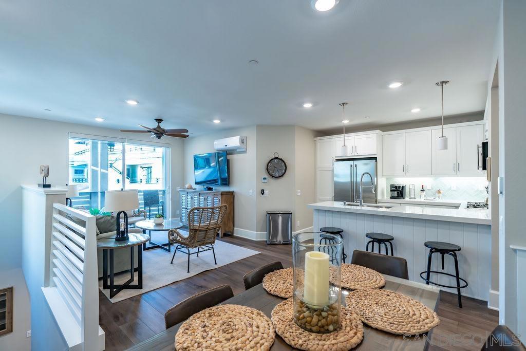 Welcome to this immaculate 3 bedroom, 2 bath beach house, just a brisk walk to both Mission Bay and Mission Beach! Peek water views from Balcony! The space This freshly built, crisp and clean residence is fully-equipped with everything you need for the ideal beach vacation. Beautiful Mission Bay is a mere short steps from the front door and famous Mission Beach is just a short stroll until your feet hit the sand. The three bedrooms are perfectly situated with the primary being an en-suite complete with king bed and bathroom with gleaming shower, along with two additional guest bedrooms each with their own comfy queen beds. All rooms have flat screen TV's for your enjoyment. There is a combo shower/tub guest bathroom as well. The sunny living room flows into the lavish kitchen and dining for the ideal gathering space - relax, cook, and take in the coastal breeze. Delight in a cup of coffee in the sleek, bright kitchen at the breakfast bar with three barstool seats, and savor a casual lunch or sundown dinner at the dining table which accommodates six people. The kitchen features polished countertops and stainless steel appliances to create all your favorite dishes, but you can also grill outside should you desire. Sliding doors open to the balcony off of the living room which boasts a bay view and covered lounge space, plus there is a spacious entry patio complete with table/chairs, and firepit for watching sunsets and open air dining. You'll also enjoy the the BBQ and outdoor shower! RATES ARE SUBJECT TO LENGTH OF TERM AND SEASON. Welcome to this immaculate 3 bedroom, 2 bath beach house, just a brisk walk to both Mission Bay and Mission Beach! Peek water views from Balcony! The space This freshly built, crisp and clean residence is fully-equipped with everything you need for the ideal beach vacation. Beautiful Mission Bay is a mere short steps from the front door and famous Mission Beach is just a short stroll until your feet hit the sand. The three bedrooms are perfectly situated with the primary being an en-suite complete with king bed and bathroom with gleaming shower, along with two additional guest bedrooms each with their own comfy queen beds. All rooms have flat screen TV's for your enjoyment. There is a combo shower/tub guest bathroom as well. The sunny living room flows into the lavish kitchen and dining for the ideal gathering space - relax, cook, and take in the coastal breeze. Delight in a cup of coffee in the sleek, bright kitchen at the breakfast bar with three barstool seats, and savor a casual lunch or sundown dinner at the dining table which accommodates six people. The kitchen features polished countertops and stainless steel appliances to create all your favorite dishes, but you can also grill outside should you desire. Sliding doors open to the balcony off of the living room which boasts a bay view and covered lounge space, plus there is a spacious entry patio complete with table/chairs, and firepit for watching sunsets and open air dining. You'll also enjoy the the BBQ and outdoor shower! For added satisfaction, there are air conditioning systems throughout the home, in-unit washer and dryer, sleeper sofa couch, and one compact parking space in the garage. This home is where guests can unwind and enjoy the beach lifestyle in a relaxed, yet splendid atmosphere! Sleeping Accommodations (Maximum 6 guests): Bedroom 1 - King bed Bedroom 2 - Queen bed Bedroom 3 - Queen bed Sleeper sofa Guest access You get to enjoy the entire home during your stay. Other things to note - Pack n' play and high chair available for rent - $25 each plus tax - Puzzles and board games provided. - This property has two levels so there are stairs. The main level is entrance, laundry and garage. The second level includes the living/dining spaces and all bedrooms/baths. - There is one garage parking space for a compact vehicle. Large cars will not fit in the space. There is street parking otherwise. - You must be 21 years or older to r...