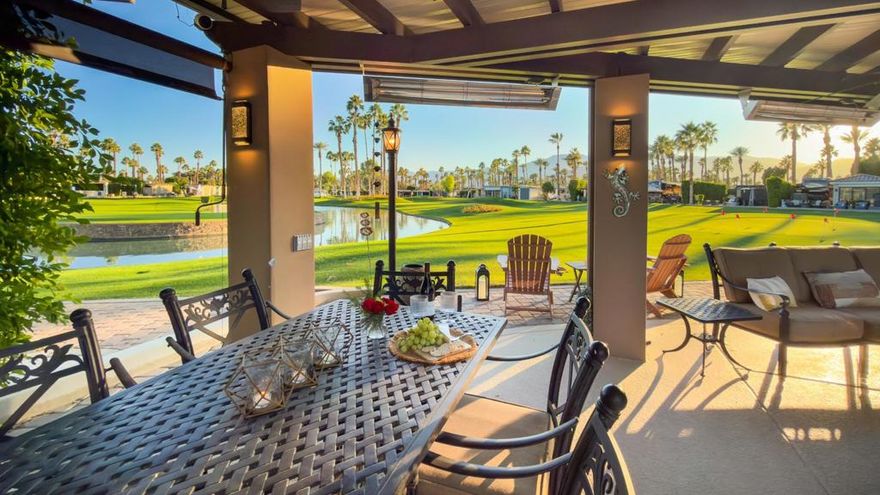 Outdoor Resort Indio is a Class A Motorcoach resort. This is an RV lot. Beautifully upgraded and exceptionally private, this RV lot at Outdoor Resort Indio offers luxury outdoor living with stunning golf course, lake, and mountain views--and is just a very short walk to the clubhouse and all its amenities.A spacious outdoor kitchen features tile counters, stainless steel appliances, oven, BBQ, countertop burner, double sink, new fridge, dishwasher, hot water, garbage disposal, and a generous kitchen island/bar.The impressive L-shaped Alumawood pergola includes three ceiling fans, three radiant heaters, extensive lighting, sconces, and manual shades for year-round comfort. A surfaced RV pad matches the kitchen and ties the space together.Enjoy a built-in entertainment center with roll-up TV door plus quality furnishings: a dining table with six chairs, two bar stools, and two sofas with a fire table and end tables. Custom covers for the kitchen and furniture.With its north-facing coach orientation, privacy, premium views, and unbeatable proximity to the clubhouse, this lot is ready to enjoy from the moment you arrive.