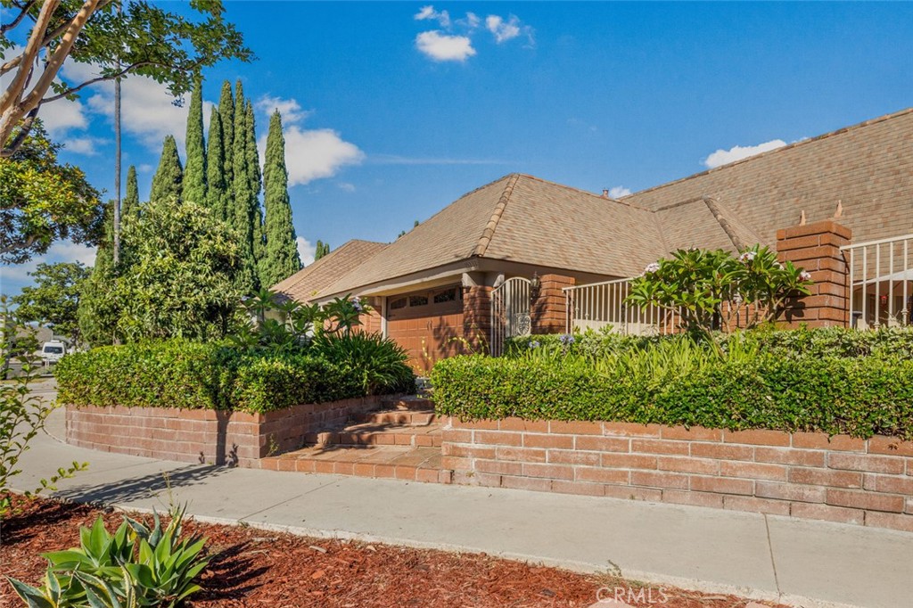 Need more living space and a larger yard? Look no further than this detached single-family home ideally located on a quiet cul-de-sac in The Ranch. This classic Granada home is anchored by a beautifully landscaped front yard. Brick paving continues along both side yards and into the backyard, making private strolls irresistible. As you step inside, you'll be welcomed by an open floor plan filled with natural light and wide-plank flooring in a neutral honey tone. Through the sliding glass doors, enjoy refreshing California breezes and sunshine from the privacy of your own brick-lined backyard. Back inside, the adjacent family and dining rooms provide the perfect layout for entertaining. A separate living room offers a cozy, relaxed atmosphere with warm wood paneling and a charming fireplace. This big room can easily be transformed into a downstairs bedroom, with the option to convert the existing wet bar into an en-suite shower. The kitchen is every cook's dream, featuring ample cabinetry and abundant counter space, ideal for preparing memorable dinners or a quick snack. Upstairs, you'll find all the bedrooms and a primary suite with an en-suite bathroom, creating a private retreat. With no Mello Roos and no mandatory HOA, The Ranch is known for its closely-knit community. Neighborhood traditions and events organized by a volunteer HOA foster a warm and welcoming atmosphere. Conveniently located near the 405 and 5 freeways, as well as local toll roads, this home offers easy access to award-winning Irvine schools, shopping centers, and other popular attractions. The nearby Irvine Spectrum is a shopper’s paradise with endless retail and dining options. You’ll also enjoy proximity to public parks and premier golf courses. Come see this home for yourself and begin your next chapter at 15232 Lille Circle!
