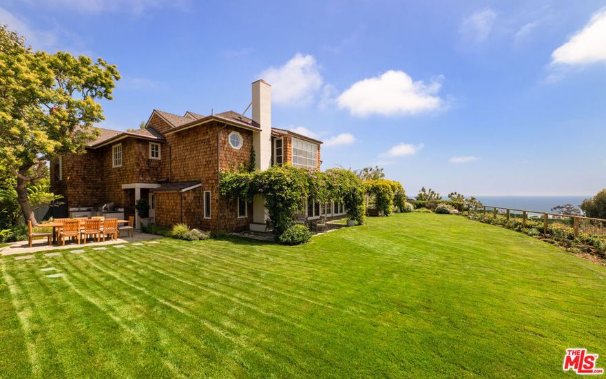 Situated behind gates this traditional East Coast shingled home boasts spectacular ocean views, beautiful gardens, and total privacy. Located on one of the Westside's most prestigious streets with a large living room w/ high beamed ceiling, gourmet kitchen w/ large center island, open family room, and formal dining room all with French doors and windows opening to a spectacular gardens, outdoor loggia in an idyllic setting all overlooking stunning ocean views. Beautiful primary suite and guest/family bedrooms creating the perfect environment.
