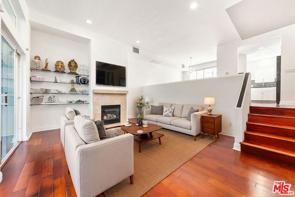 Tucked away in the coveted Norma Triangle of West Hollywood, this elegant three-level townhome offers the perfect blend of luxury, comfort, and convenience in a gated community just steps from Sunset Boulevard. The light-filled interior features hardwood floors, skylights, recessed lighting, and a cozy fireplace, with sliding glass doors that open to multiple private outdoor spaces, including two patios and a rooftop deck with panoramic city views. The thoughtfully designed layout includes a bright, modern kitchen, formal dining area, and three spacious bedrooms, two with en-suite baths and walk-in closets, and one ideal for use as a guest room or home office. Surrounded by world-class dining, shopping, and entertainment, this home is a rare opportunity to live stylishly in one of Los Angeles' most vibrant and desirable neighborhoods.