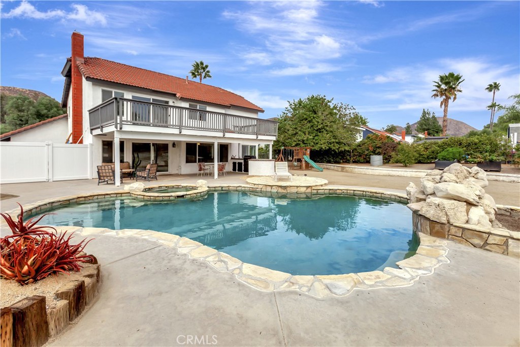 Welcome home to this fully remodeled retreat in Wildomar, where comfort and California living come together. Sitting on a generous 20,000-square-foot lot with low taxes and no HOA, this home was designed for easy living and effortless entertaining. The open-concept layout connects a beautifully updated kitchen to the family room with a cozy fireplace, creating a warm and inviting space to gather. Step outside to enjoy a sparkling pool and spa, built-in barbecue, and a large open yard ready for whatever life brings — from entertaining to expanding. The property also features a dedicated chicken coop area, raised vegetable beds for growing your own food, and plenty of extra space alongside the driveway for boat or recreational parking. With newly remodeled kitchen, three updated bathrooms, new LVP floors, and newer systems including HVAC, water heater, and windows, this home offers modern comfort, thoughtful upgrades, and pride of ownership throughout.