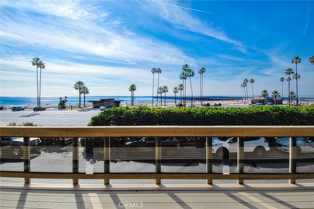 Just moments from the sand in the gated enclave of Breakers Drive, this rare offering in Corona del Mar showcases sweeping, front-row ocean views from nearly every angle. The two-bedroom, two-bath ADU features an all-glass front that frames dramatic vistas of the harbor entrance, jetty, beach, and Catalina Island beyond.
Located on a private, gated street with direct access to Corona del Mar Beach, the home is designed for effortless coastal living. The entry level leads to a second-floor living area and bedrooms, where wood-beamed ceilings add warmth and character. The open-concept kitchen, dining, and living areas are anchored by a fireplace and flow seamlessly onto a large viewing deck—perfect for enjoying the panoramic coastal views.
Additional features include a one-car garage, one parking space behind the garage door, and another space across the street. The home is also conveniently close to the Village of Corona del Mar, tide pools, Fashion Island, Pelican Hill Resort, John Wayne Airport, and some of Orange County’s most sought-after beaches.