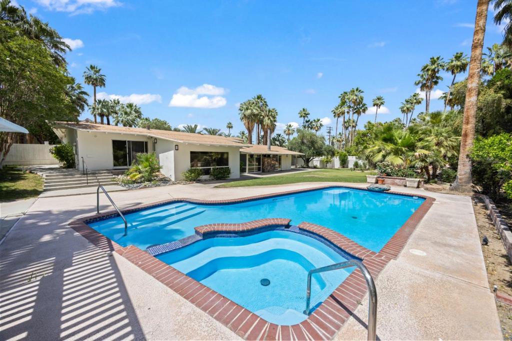 LIMITED-TIME OFFER! GET $500 SIGNING BONUS WHEN WE SECURE A LEASE ON OR BEFORE AUGUST 01, 2025. MESSAGE US FOR DETAILS. Poised on a quiet street in one of Palm Springs most distinguished neighborhoods, this impeccably maintained 3-bedroom, 3-bath home reflects a standard of living that values both elegance and order. The front garden is expertly landscaped and enhanced by an automatic sprinkler system. Inside, the kitchen is designed with precision and purpose, outfitted with premium stainless steel appliances. The primary bedroom features a vaulted ceiling that enhances its sense of space and calm, along with a generously sized walk-in closet complete with built-in shelving. Meanwhile, the second bedroom includes a fireplace and overlooks the pool for a touch of classic charm, and the third bedroom enjoys views of both the pool and the garden. At the back of the home lies a serene backyard retreat complete with a sparkling pool, an inviting hot tub, and a tidy storage shed. From here, you're minutes from Jensens Finest Foods, the Moorten Botanical Garden, and the charm of downtown Palm Springs. *Fireplace is for decorative use only and cannot be used without consent from Belong. Pets - Cats Only (max of 2) Pet Deposit - $500